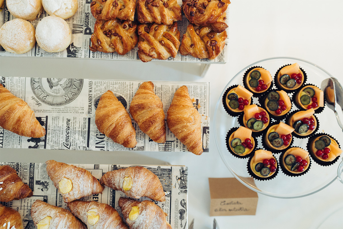 Breakfast with croissant and typical pastries.