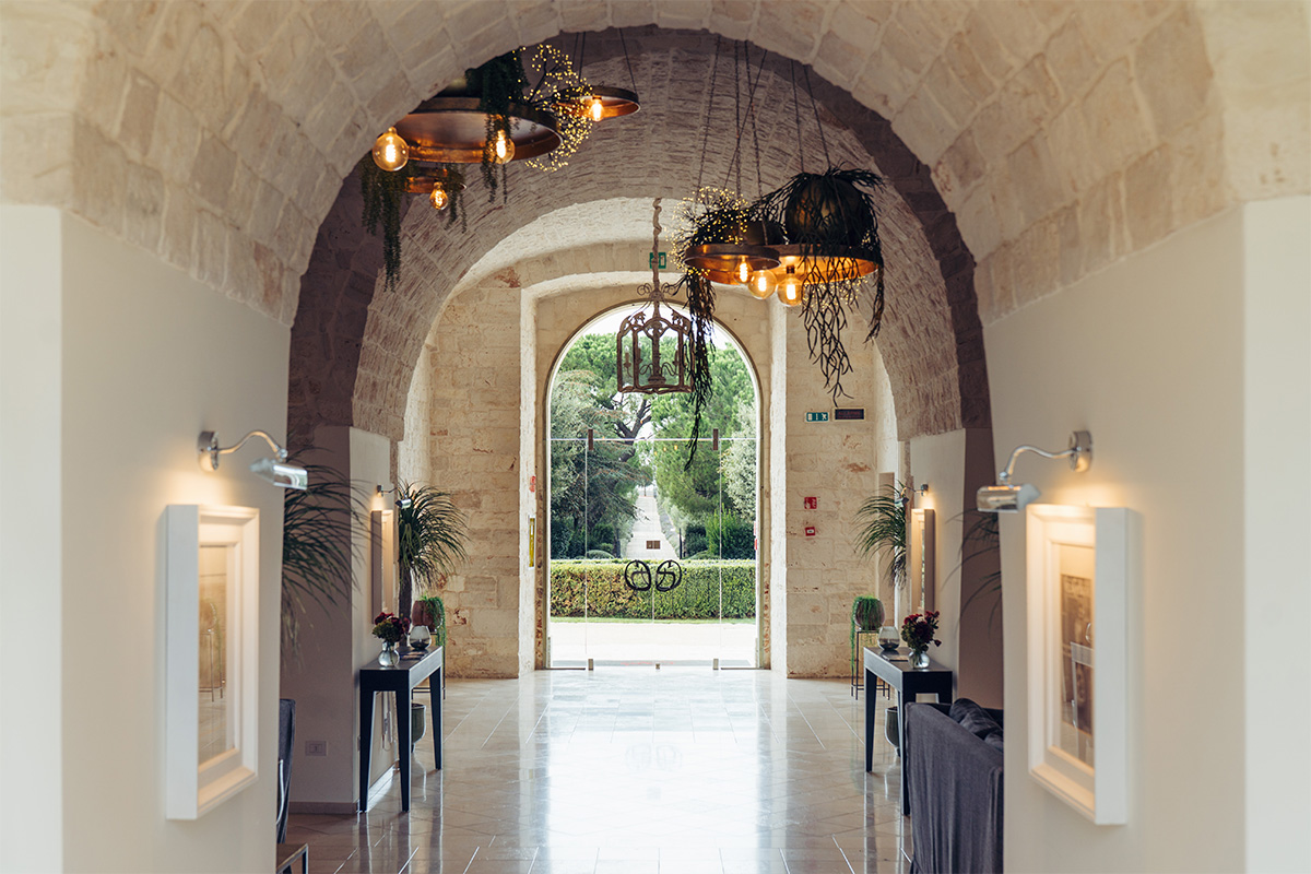 Arched Palazzo entrance with chandeliers.