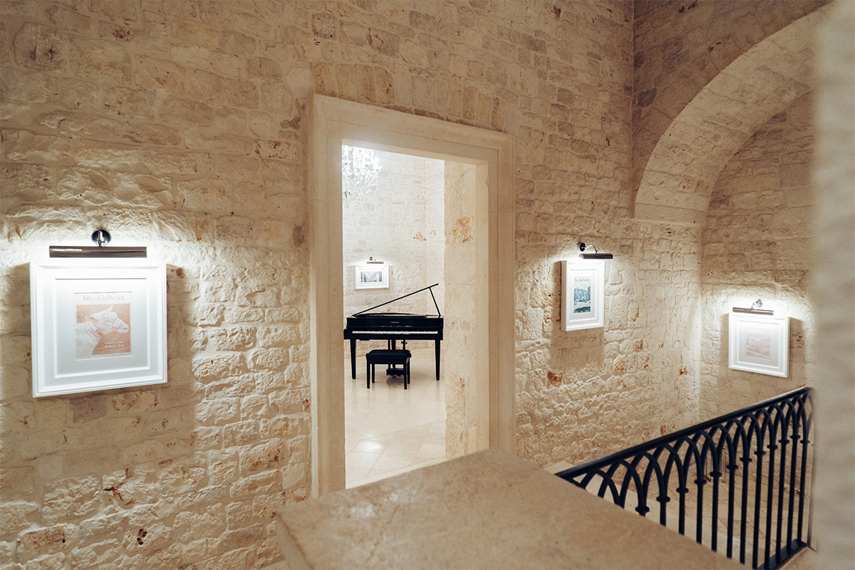 Stone corridor and art-lined Palazzo interior.