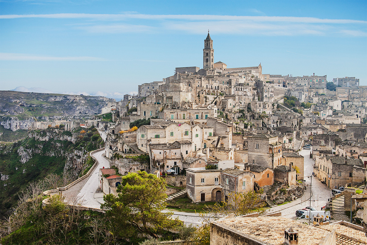Panoramic view of Matera with the Sassi, stone houses, historic streets and the cathedral at the top of the old town. 