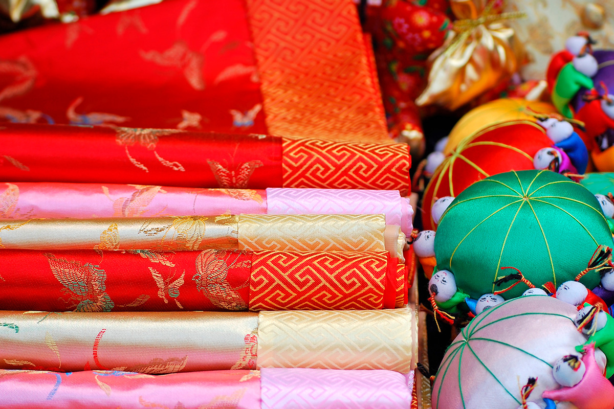 Colourful fabrics and decorations for an oriental travel-themed wedding.